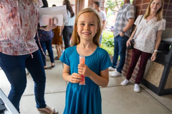 girl student with a popsicle